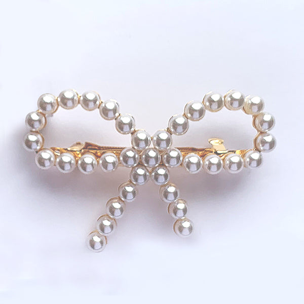 Verity Jones London — Bow shaped hair clip in gold with small pearls